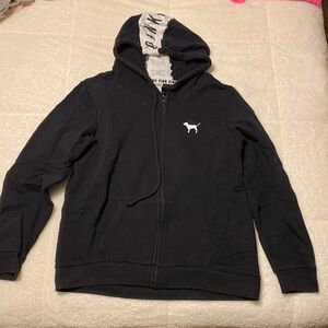 Zip up with pockets. Can fit a large